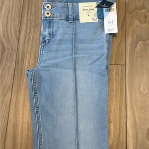 NWT Abercrombie Kids boot cut jeans in a light wash blue color, size 13/14.